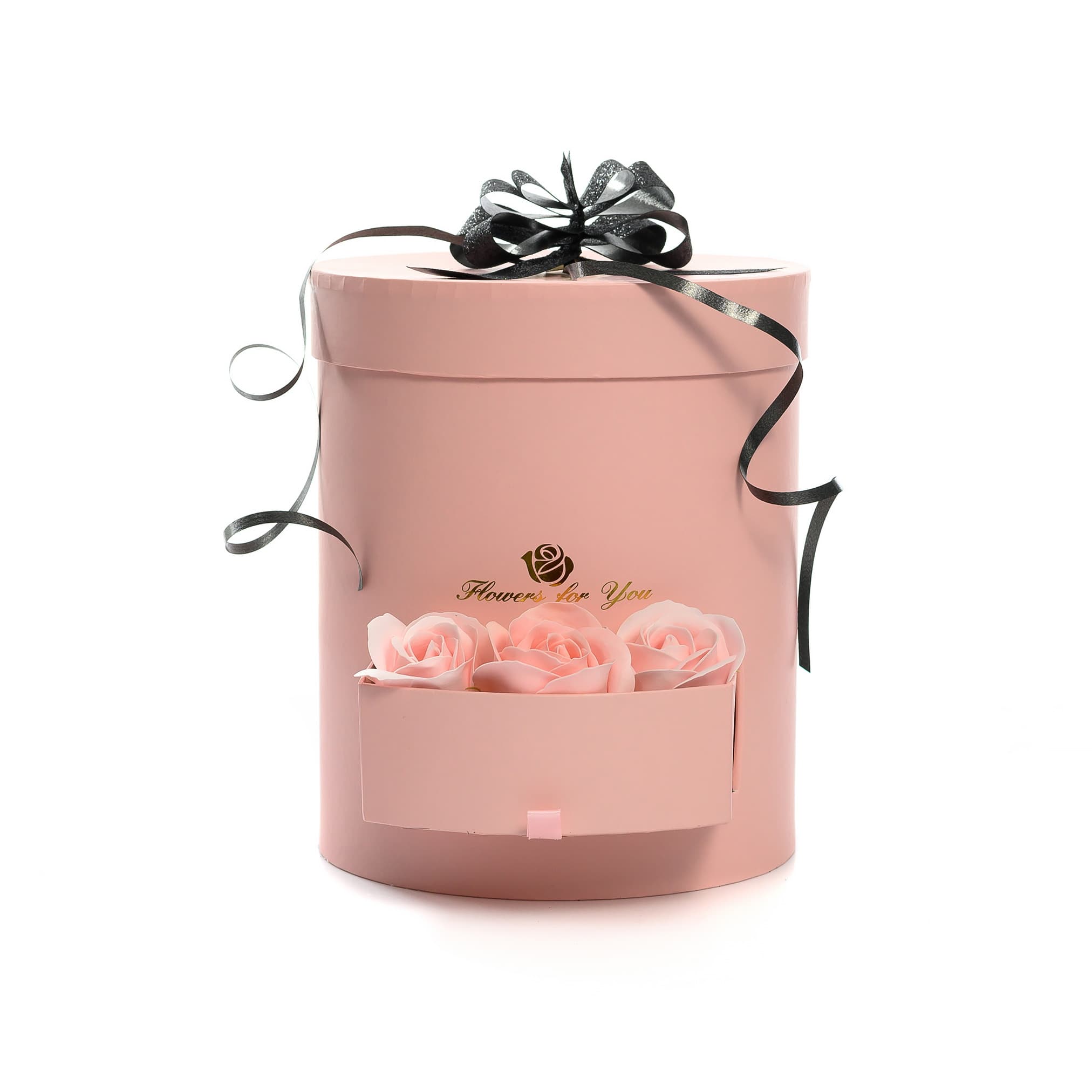 Rosa zylindrische Geschenkbox mit schwarzer Schleife und drei rosa Rosen in einer kleinen Schublade.